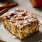 Delicious homemade apple cinnamon cake with slices and a sprinkle of cinnamon