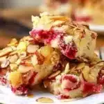 Cranberry Almond Cake with fresh cranberries and slivered almonds on top