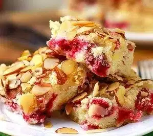 Cranberry Almond Cake with fresh cranberries and slivered almonds on top