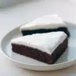 Deliciously moist Ginger Treacle Cake topped with golden syrup.