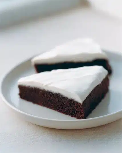 Deliciously moist Ginger Treacle Cake topped with golden syrup.