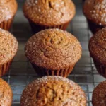 Delicious freshly baked gingerbread muffins topped with spices and sugar.