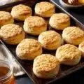 Freshly baked honey biscuits on a plate, golden and delicious