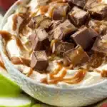 Delicious Snickers Dip served with fresh fruit for an easy 5-minute dessert.